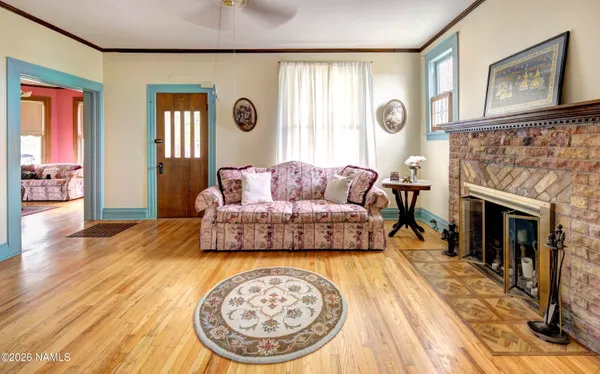 a living room with furniture and a fireplace