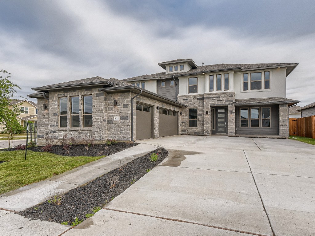 9101 Spire View Austin, TX 78744 - Photo 1 of 29 front view of a house with a yard