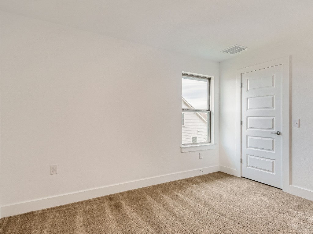 9101 Spire View Austin, TX 78744 - Photo 20 of 29 an empty room with windows