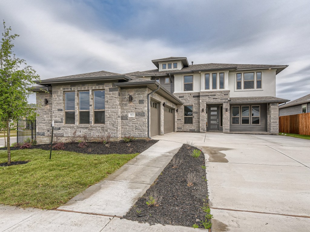 9101 Spire View Austin, TX 78744 - Photo 2 of 29 front view of a house with a yard