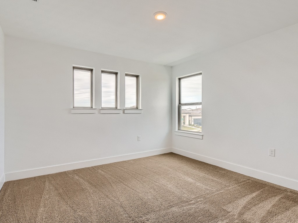 9101 Spire View Austin, TX 78744 - Photo 22 of 29 an empty room with windows