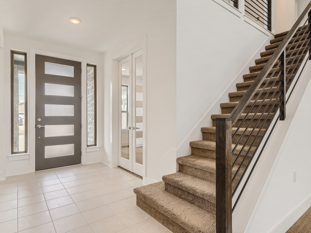 9101 Spire View Austin, TX 78744 - Photo 4 of 29 a view of an entryway with staircase
