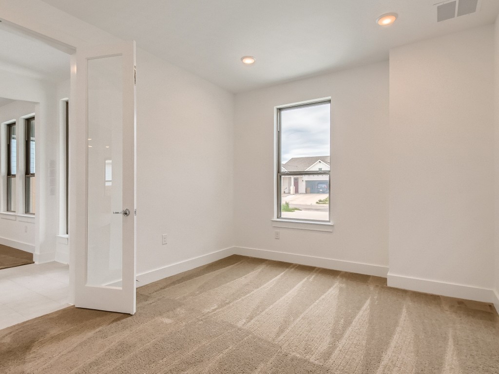 9101 Spire View Austin, TX 78744 - Photo 8 of 29 a view of an empty room with a window