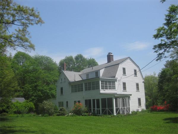 144 Nashoba Road Concord, MA 01742 - Photo 3 of 10 a view of a yard in front of a house