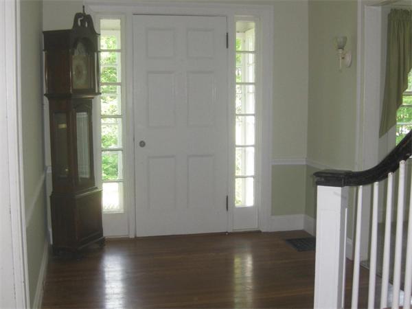 144 Nashoba Road Concord, MA 01742 - Photo 6 of 10 a view of an empty room with wooden floor and a window
