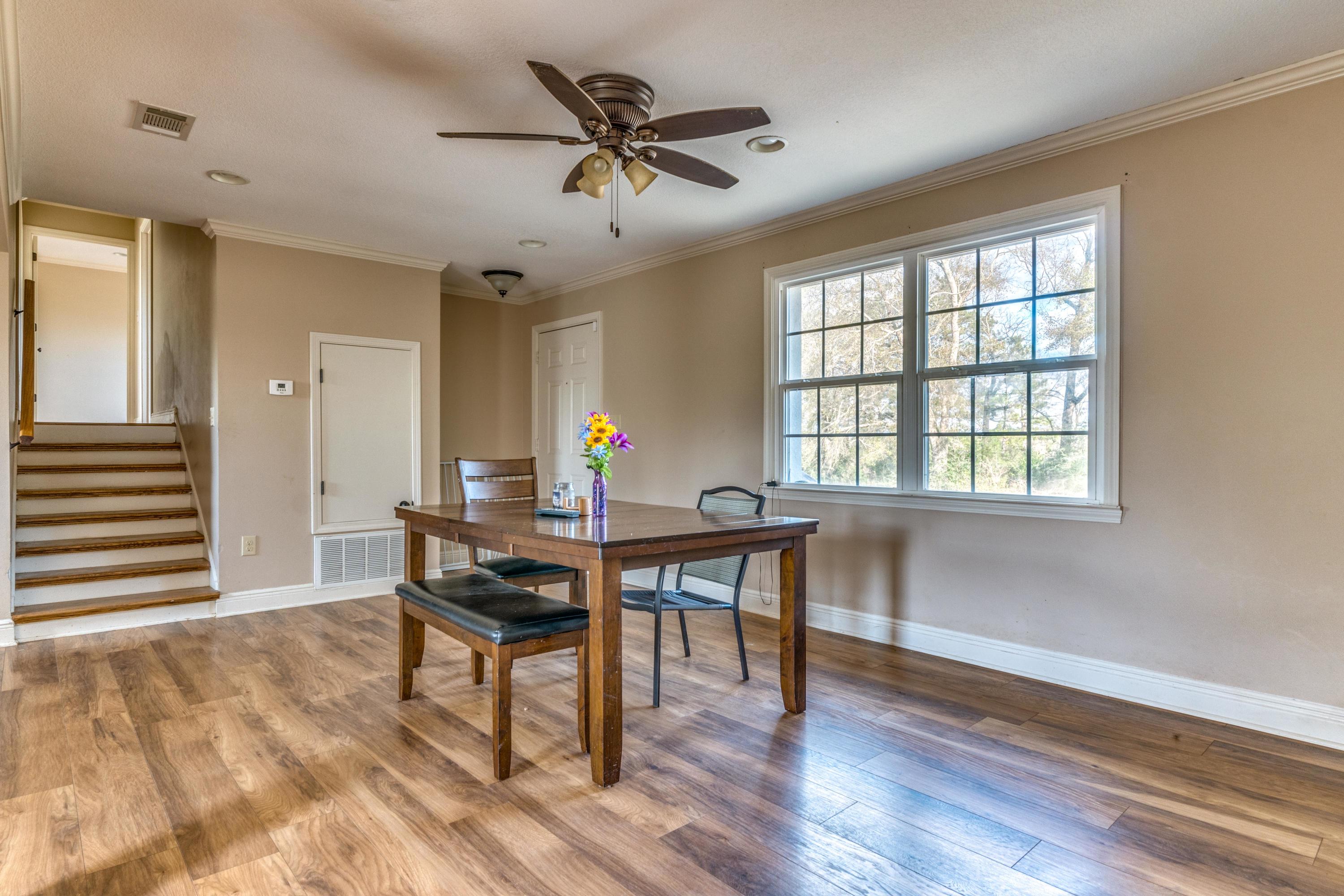 7878 Red Barrow Road Baker, FL 32531 - Photo 8 of 24 a view of a workspace with furniture and a window