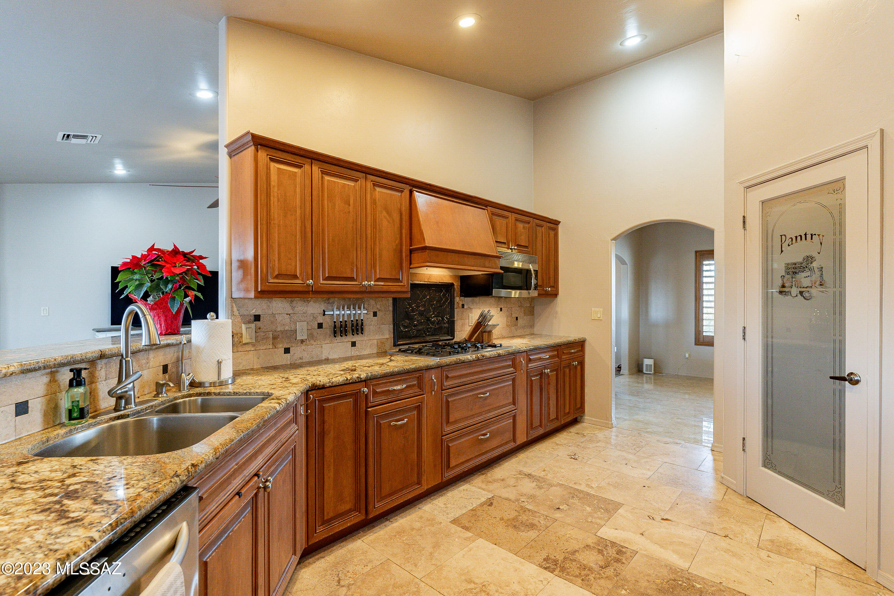 1135 Via San Francisco Rio Rico, AZ 85648 - Photo 12 of 29 a kitchen with granite countertop a sink cabinets and window