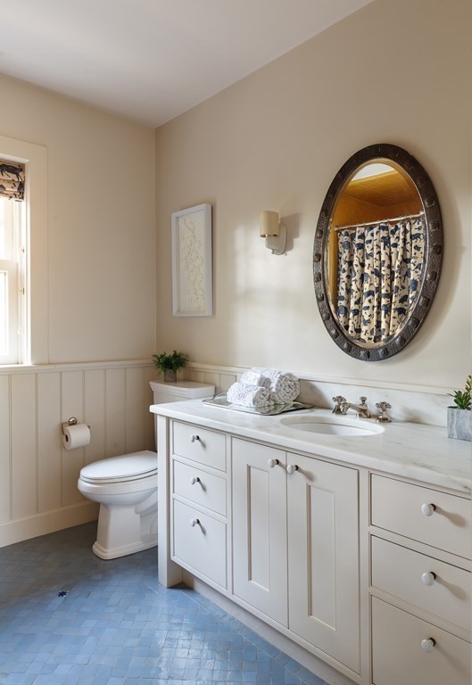 11 Hemlock Road Cambridge, MA 02138 - Photo 20 of 35 a bathroom with a toilet a sink and mirror