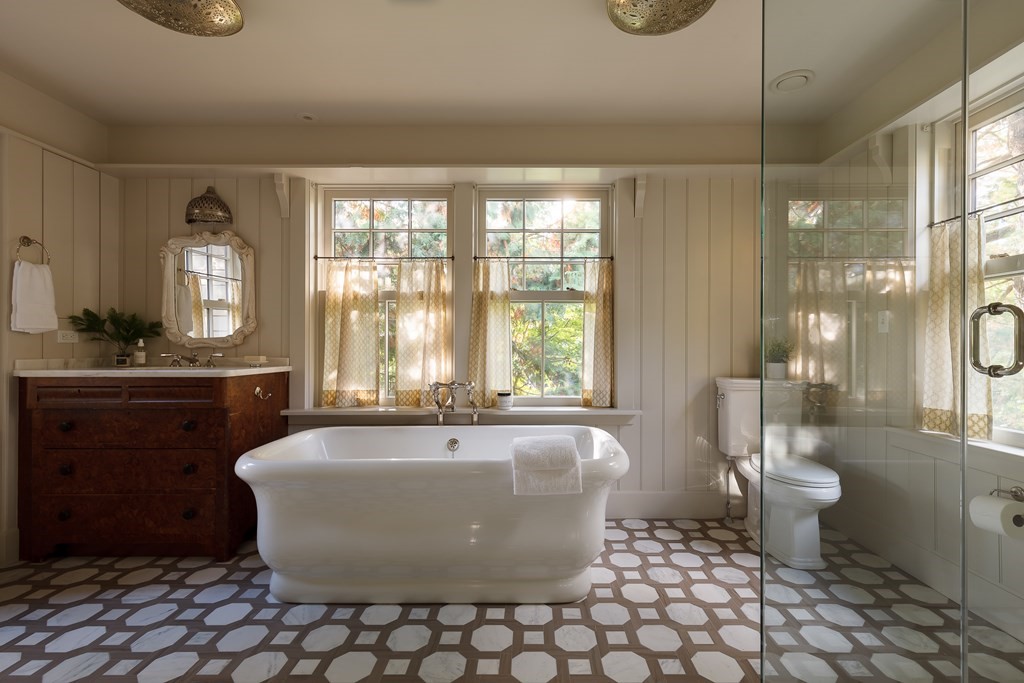 11 Hemlock Road Cambridge, MA 02138 - Photo 24 of 35 a spacious bathroom with a bathtub a toilet a sink and a shower