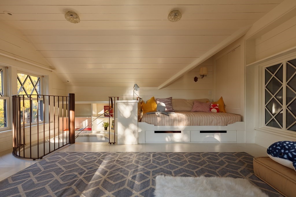 11 Hemlock Road Cambridge, MA 02138 - Photo 27 of 35 a living room with lots of furniture and a chandelier
