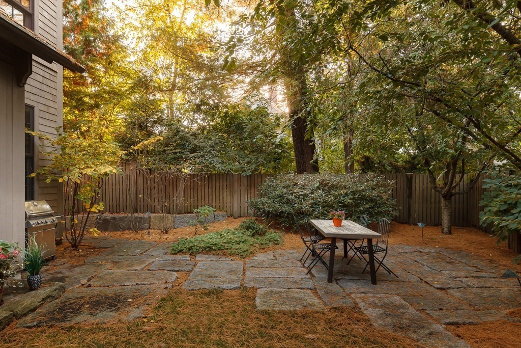 11 Hemlock Road Cambridge, MA 02138 - Photo 35 of 35 a backyard of a house with table and chairs