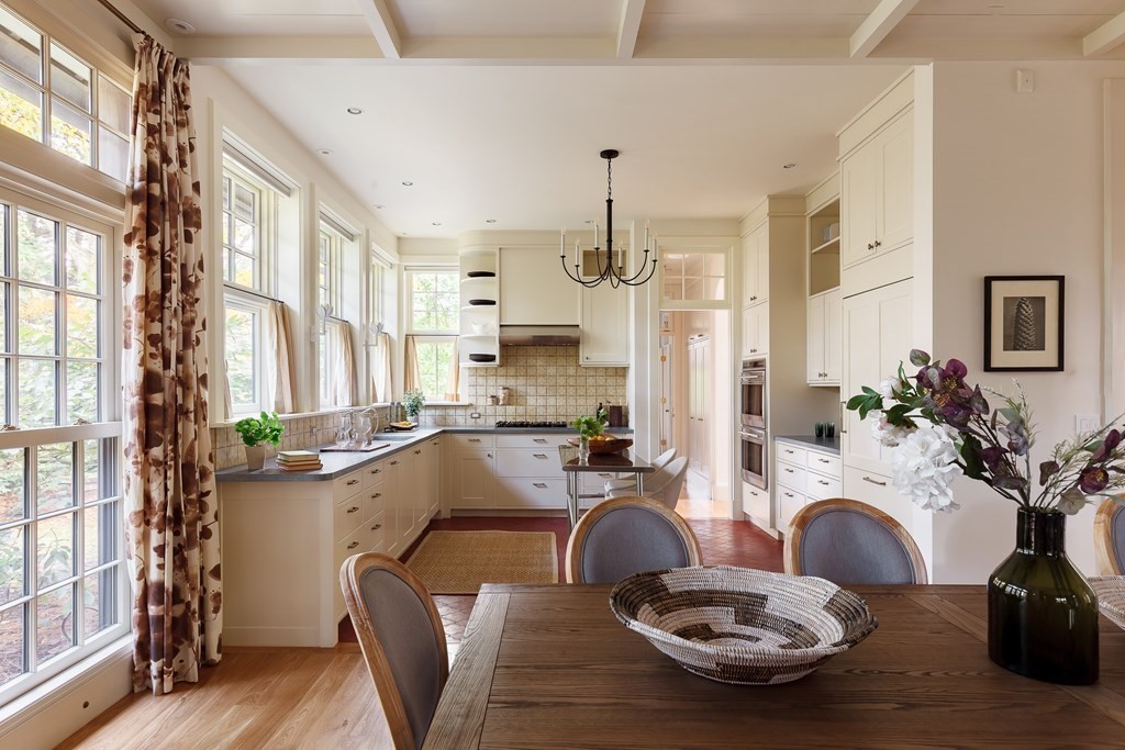 11 Hemlock Road Cambridge, MA 02138 - Photo 10 of 35 a room with furniture a large window and wooden floor