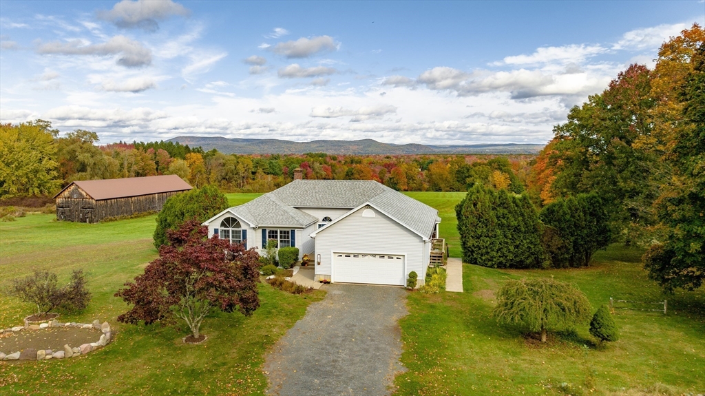 162 Chestnut Plain Road Whately, MA 01093 - Photo 1 of 42 a view of a house with a garden