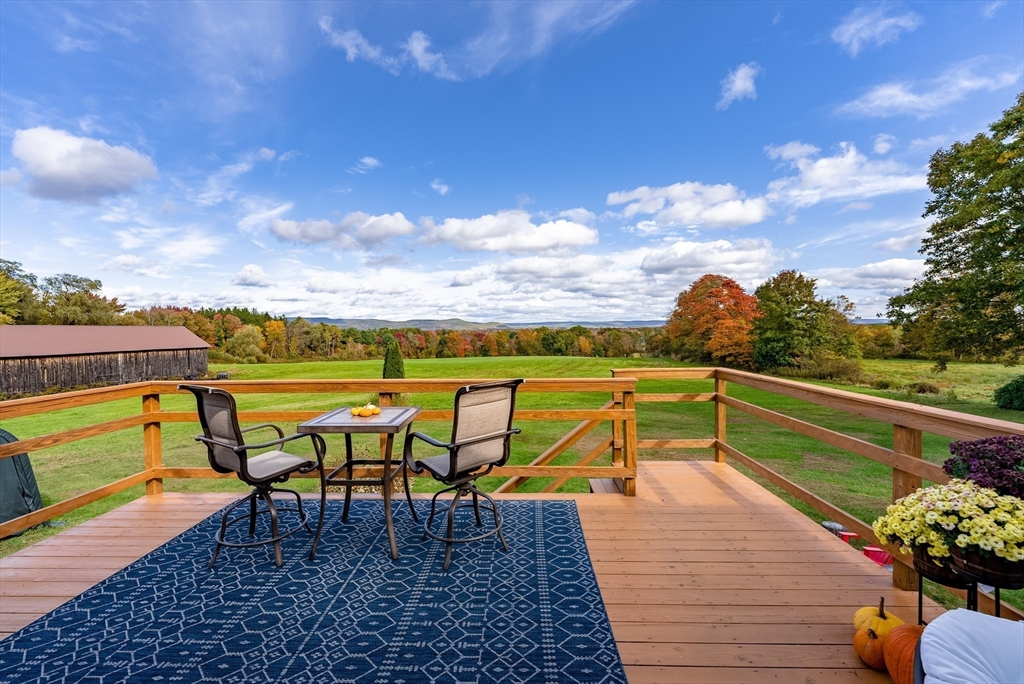 162 Chestnut Plain Road Whately, MA 01093 - Photo 12 of 42 a view of chairs and table on the terrace