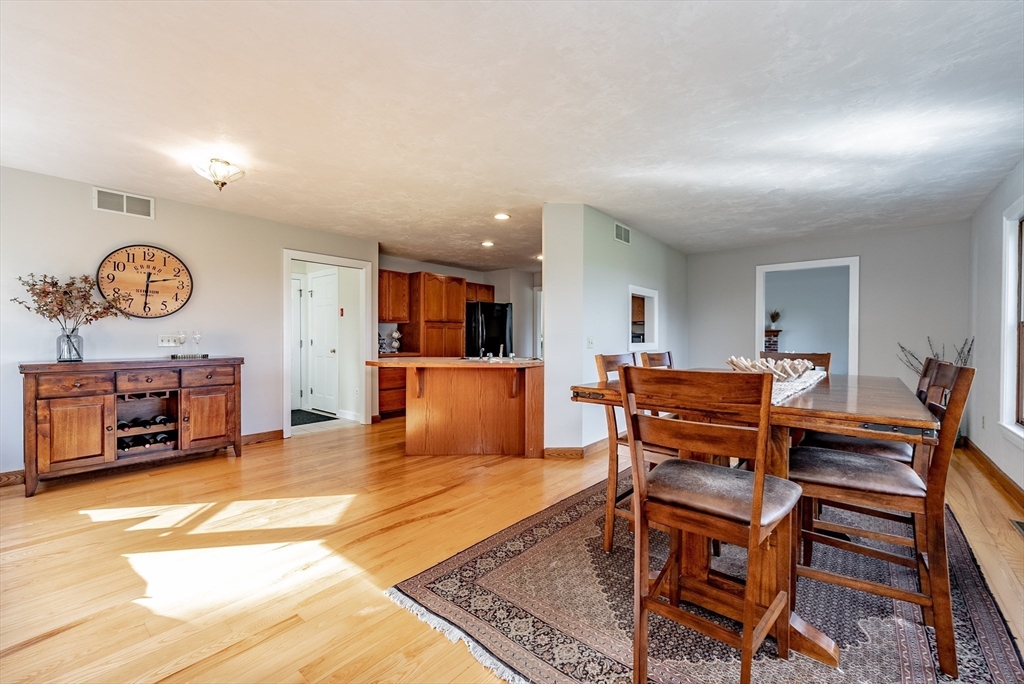162 Chestnut Plain Road Whately, MA 01093 - Photo 17 of 42 a living room with furniture a fireplace and kitchen view
