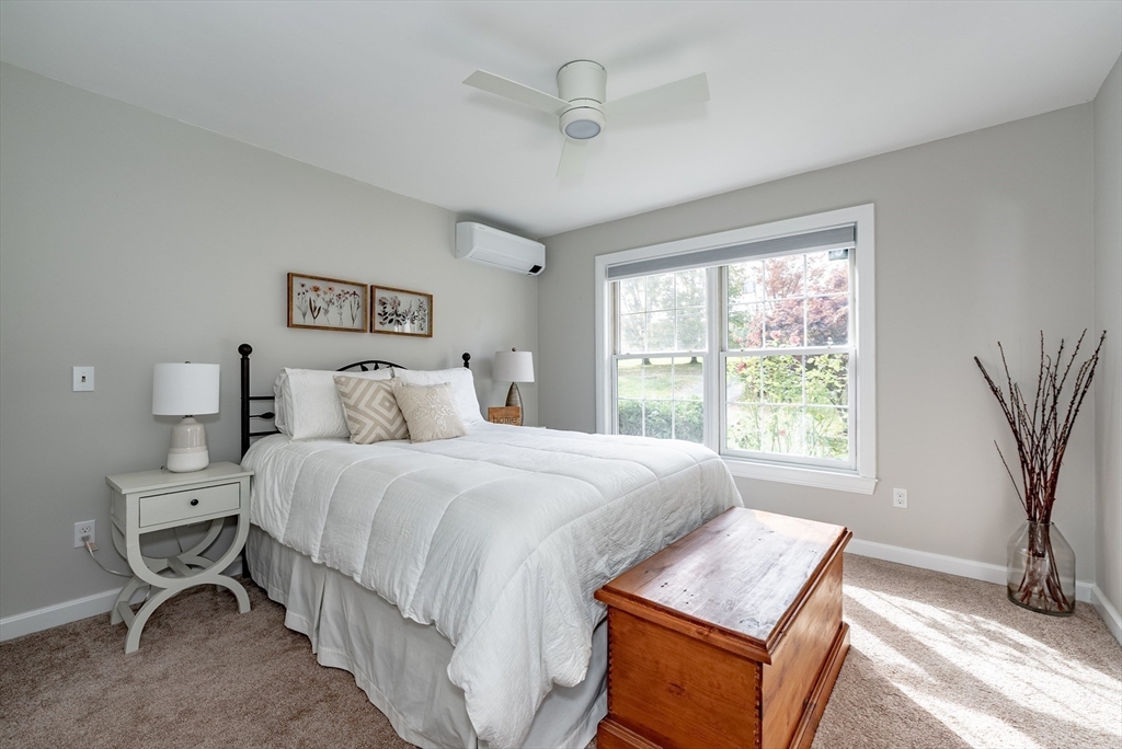 162 Chestnut Plain Road Whately, MA 01093 - Photo 22 of 42 a bedroom with a bed and a window