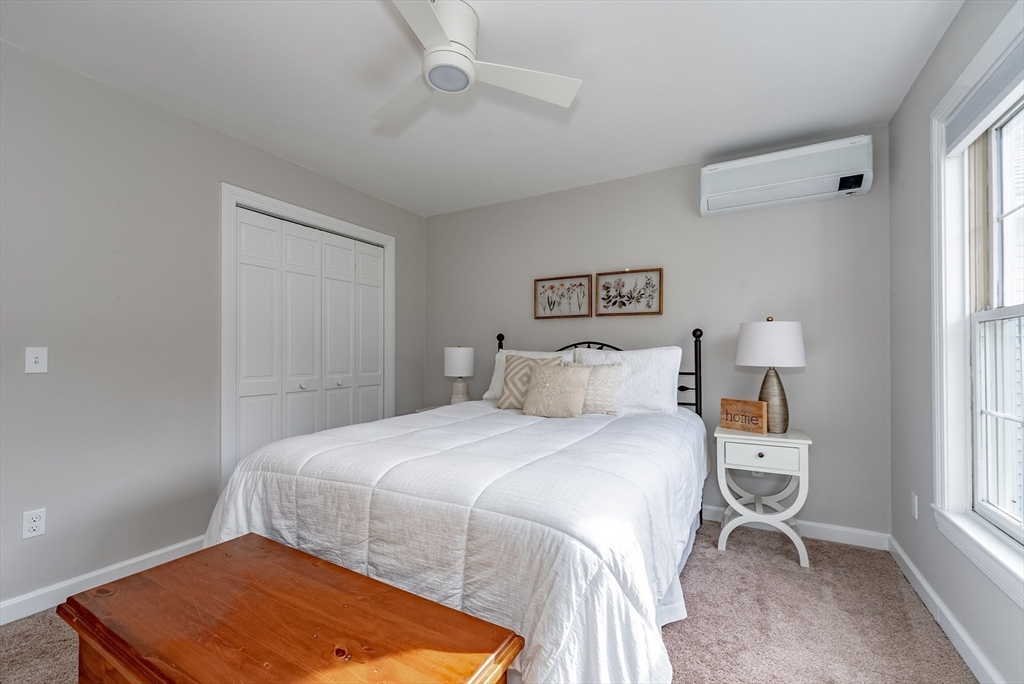 162 Chestnut Plain Road Whately, MA 01093 - Photo 23 of 42 a bedroom with a bed and a window