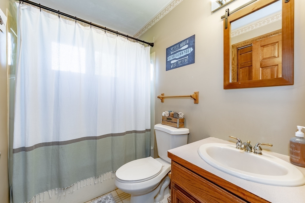 162 Chestnut Plain Road Whately, MA 01093 - Photo 24 of 42 a bathroom with a sink a toilet and a mirror
