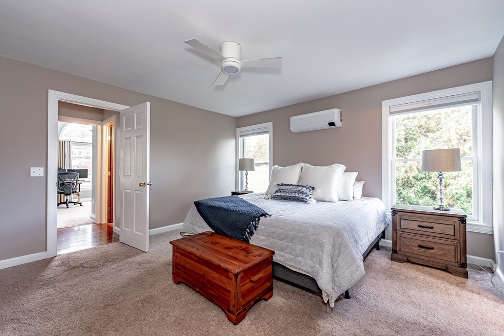 162 Chestnut Plain Road Whately, MA 01093 - Photo 25 of 42 a bedroom with a bed and window