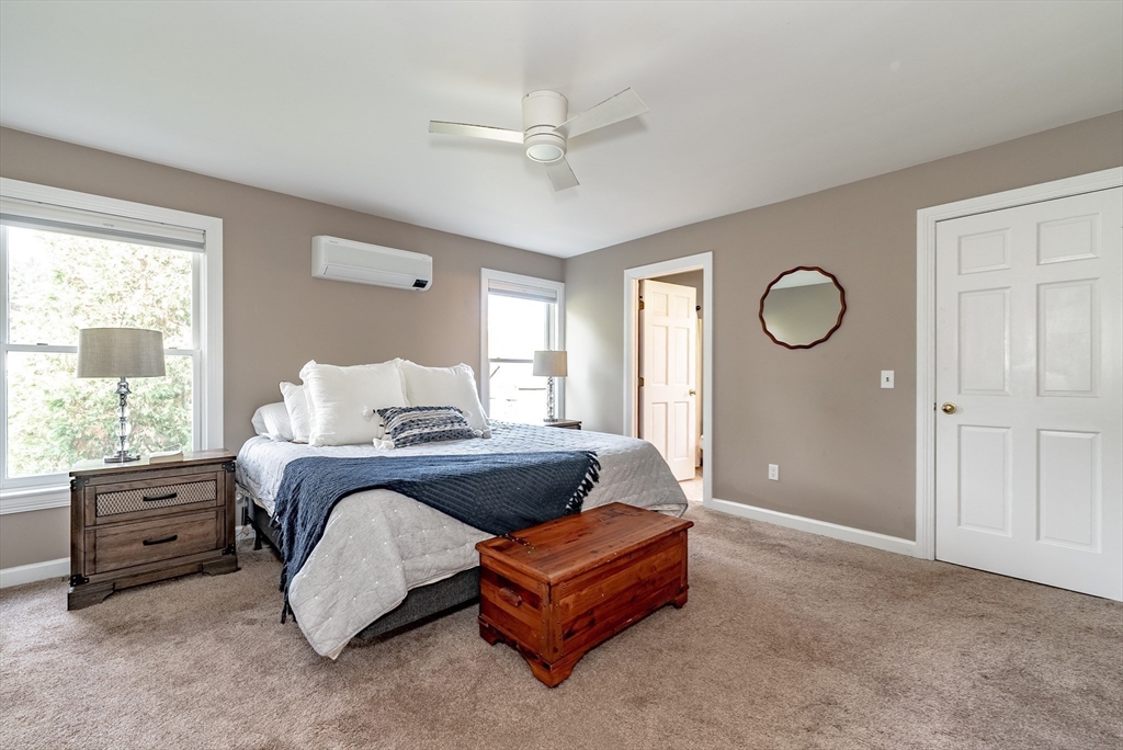 162 Chestnut Plain Road Whately, MA 01093 - Photo 26 of 42 a spacious bedroom with a bed a window and closet