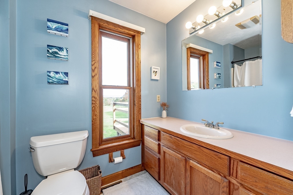 162 Chestnut Plain Road Whately, MA 01093 - Photo 27 of 42 a bathroom with a toilet a sink and a window