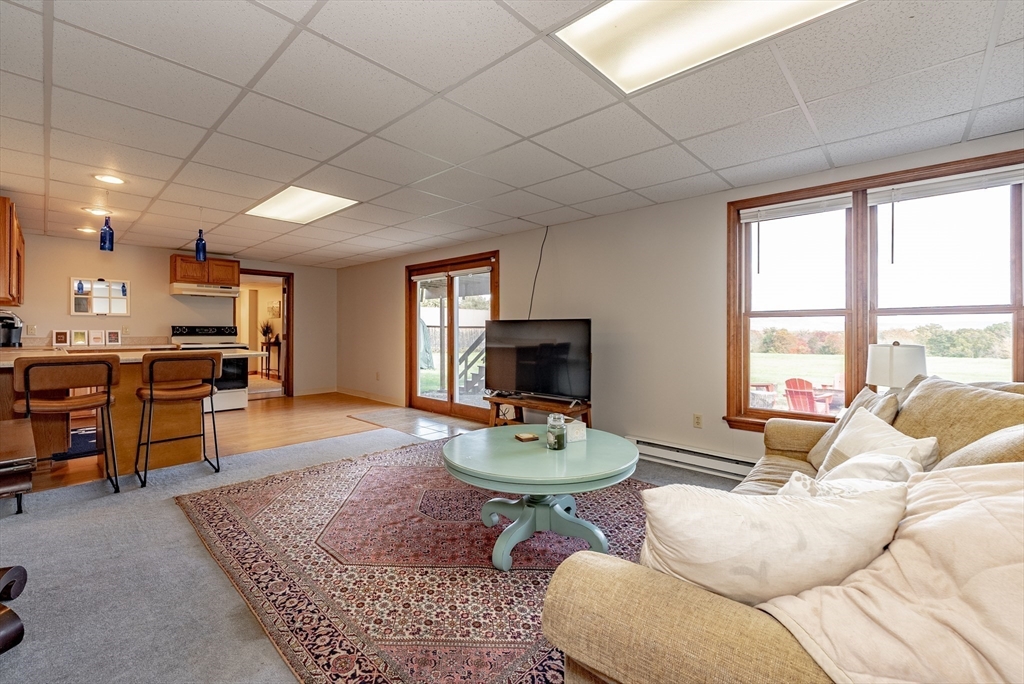 162 Chestnut Plain Road Whately, MA 01093 - Photo 29 of 42 a living room with furniture and a flat screen tv