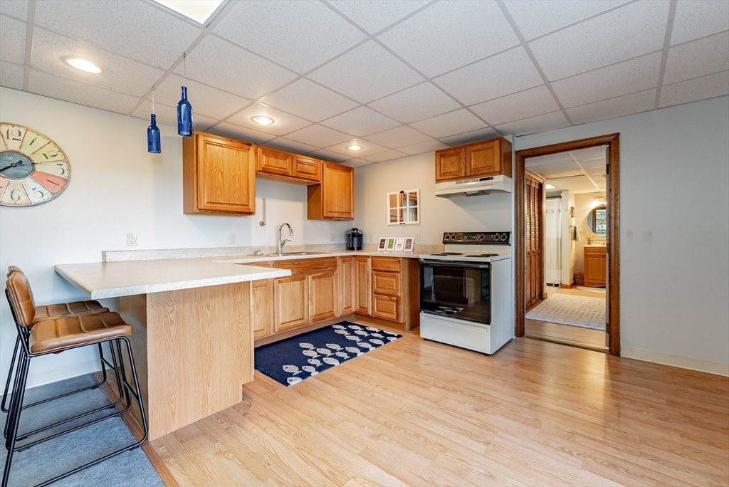 162 Chestnut Plain Road Whately, MA 01093 - Photo 32 of 42 a kitchen with stainless steel appliances granite countertop a stove a sink and a refrigerator