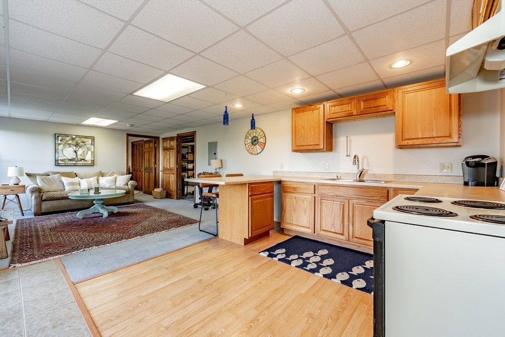162 Chestnut Plain Road Whately, MA 01093 - Photo 33 of 42 a kitchen with a sink stove and white cabinets