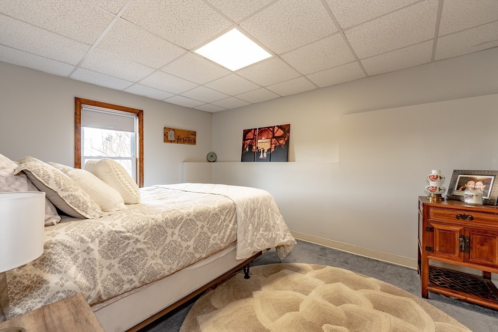 162 Chestnut Plain Road Whately, MA 01093 - Photo 34 of 42 a bedroom with a bed and a cabinets