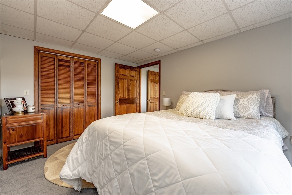 162 Chestnut Plain Road Whately, MA 01093 - Photo 35 of 42 a bedroom with a bed and a large window