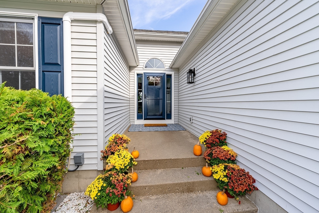 162 Chestnut Plain Road Whately, MA 01093 - Photo 6 of 42 a front view of a house with flowers