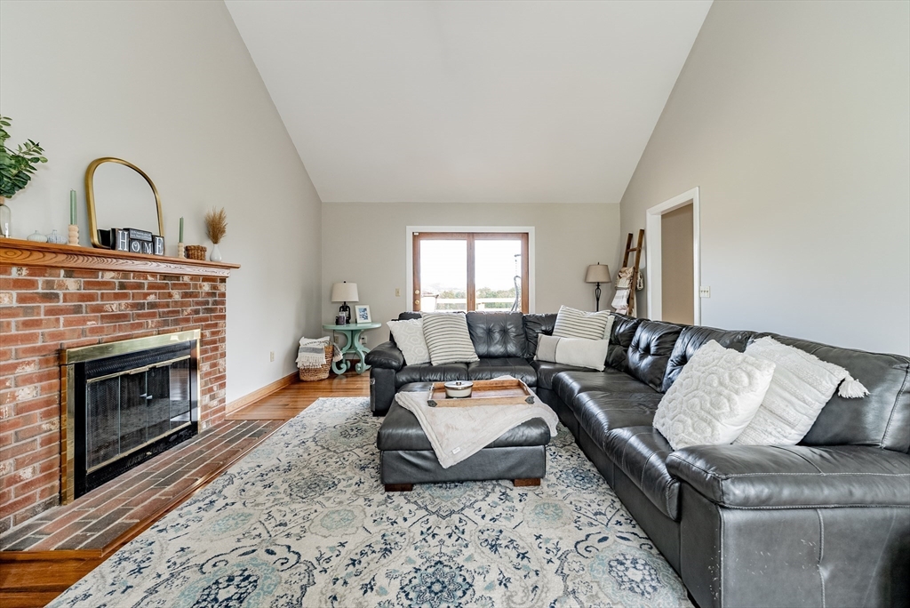 162 Chestnut Plain Road Whately, MA 01093 - Photo 9 of 42 a living room with furniture and a fireplace