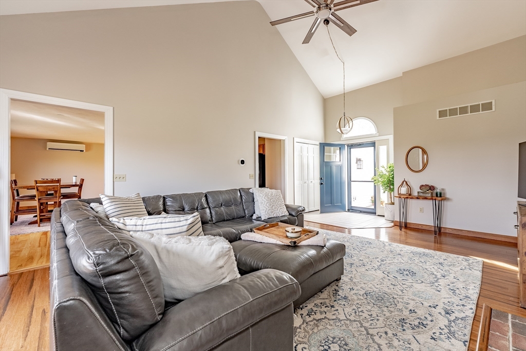 162 Chestnut Plain Road Whately, MA 01093 - Photo 10 of 42 a living room with furniture and a chandelier