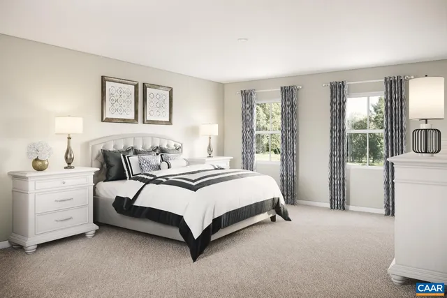 a spacious bedroom with a bed and a large window