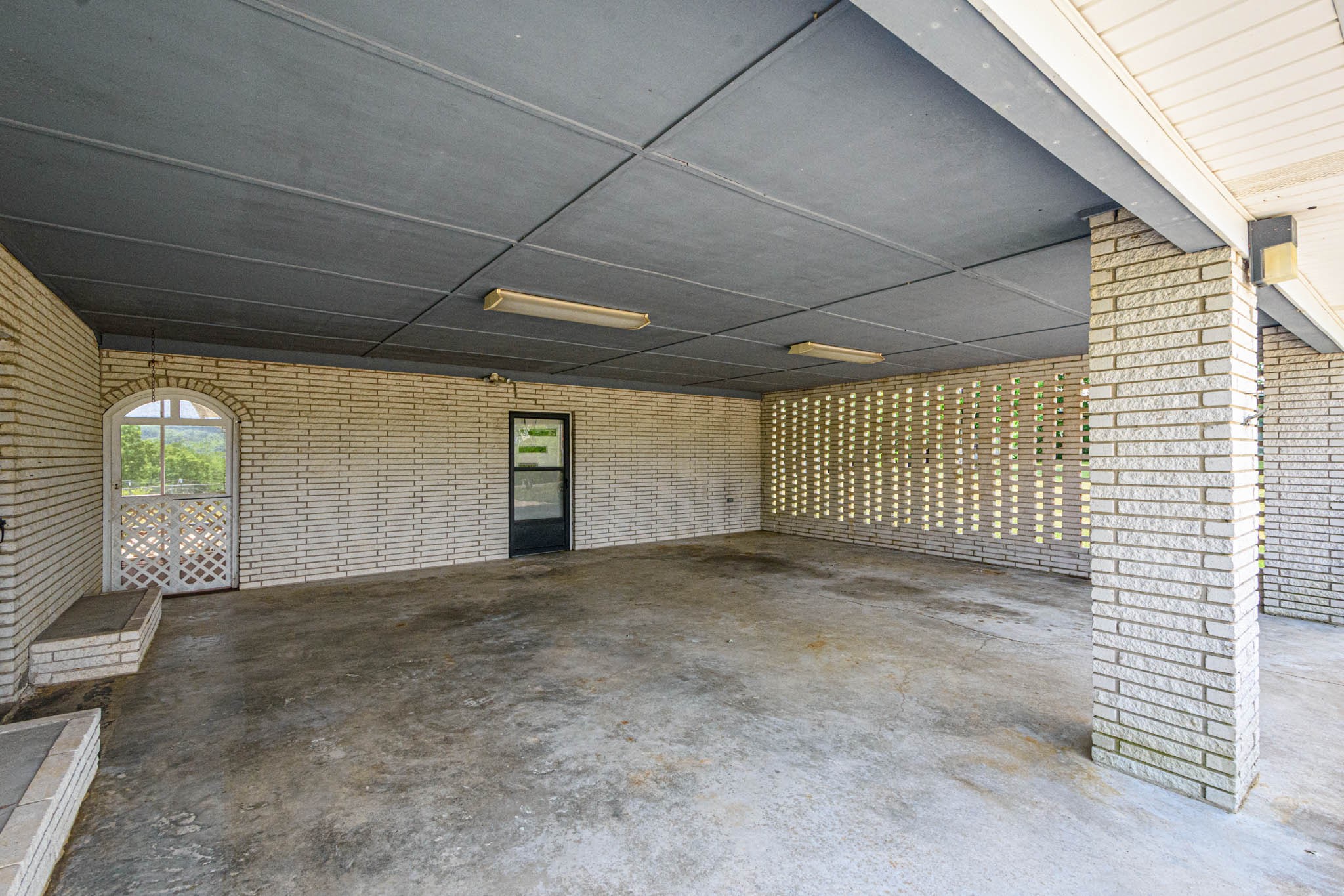 657 Prospect Road Pulaski, TN 38478 - Photo 11 of 50 a view of a livingroom with brick wall and a window