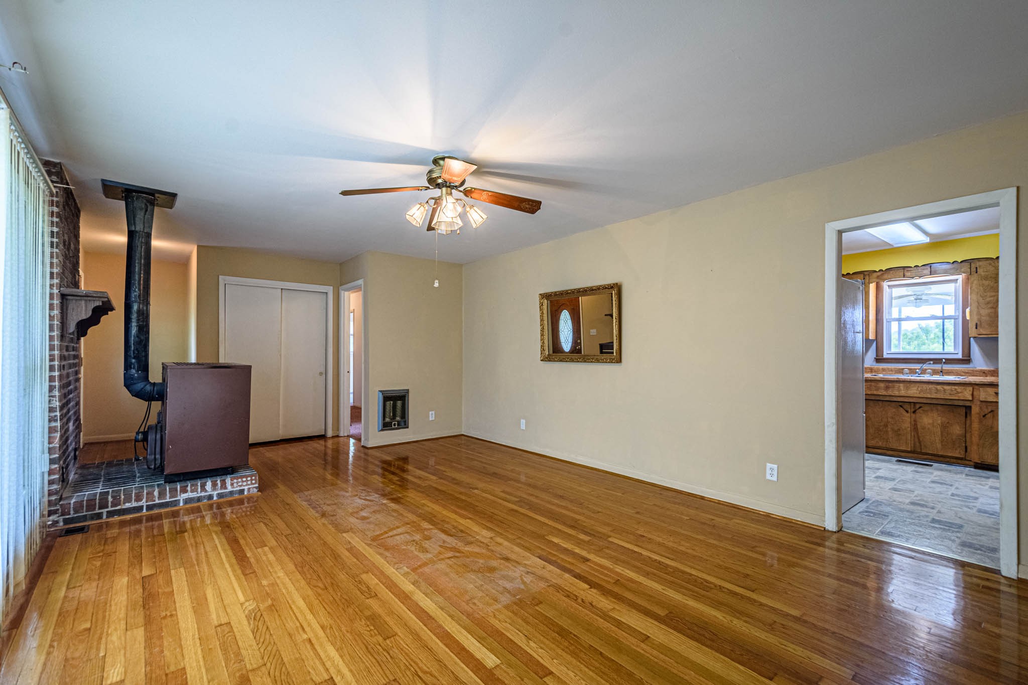 657 Prospect Road Pulaski, TN 38478 - Photo 18 of 50 a view of an empty room with a window and wooden floor