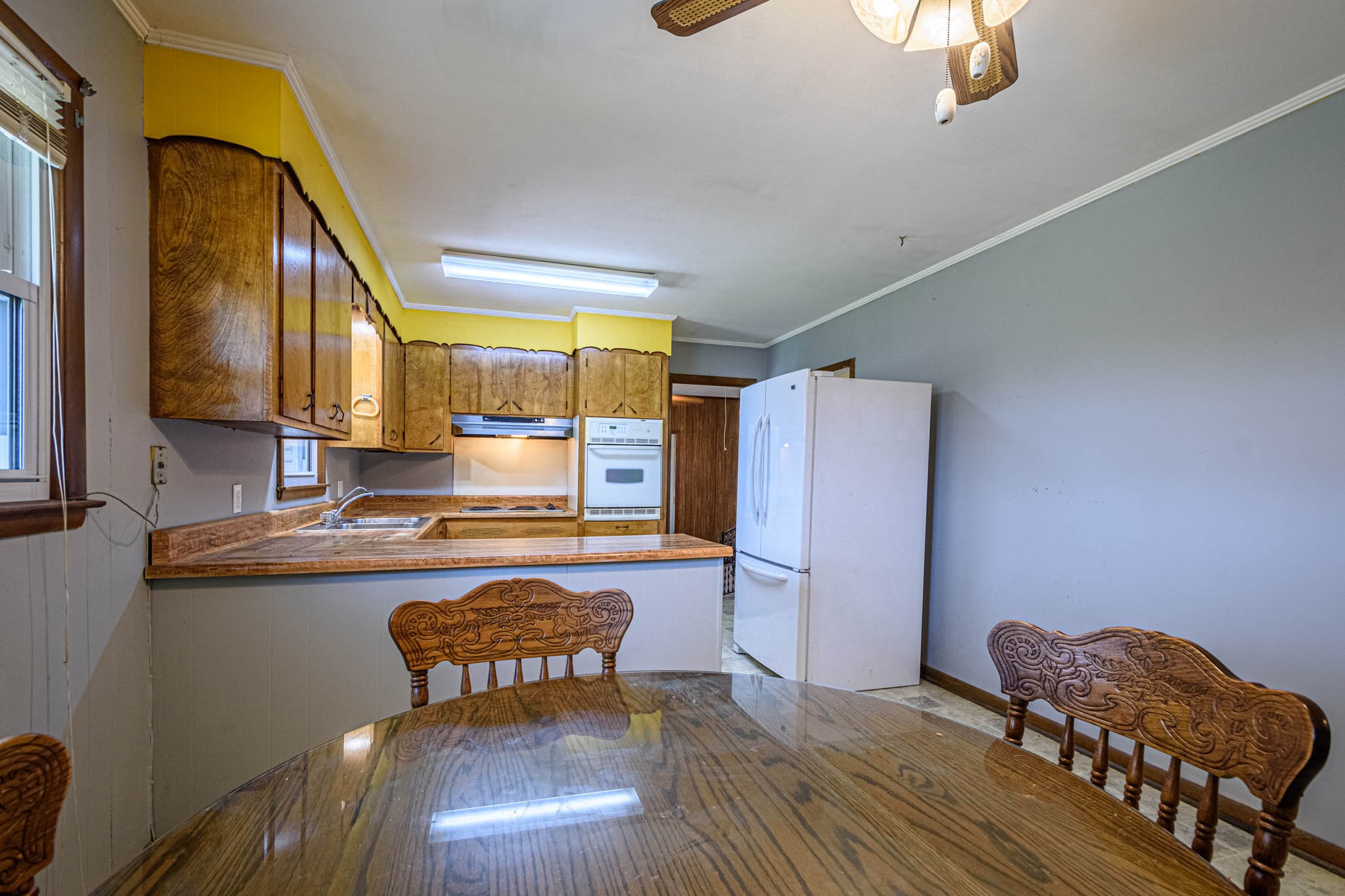 657 Prospect Road Pulaski, TN 38478 - Photo 22 of 50 a kitchen with granite countertop wooden cabinets and stainless steel appliances