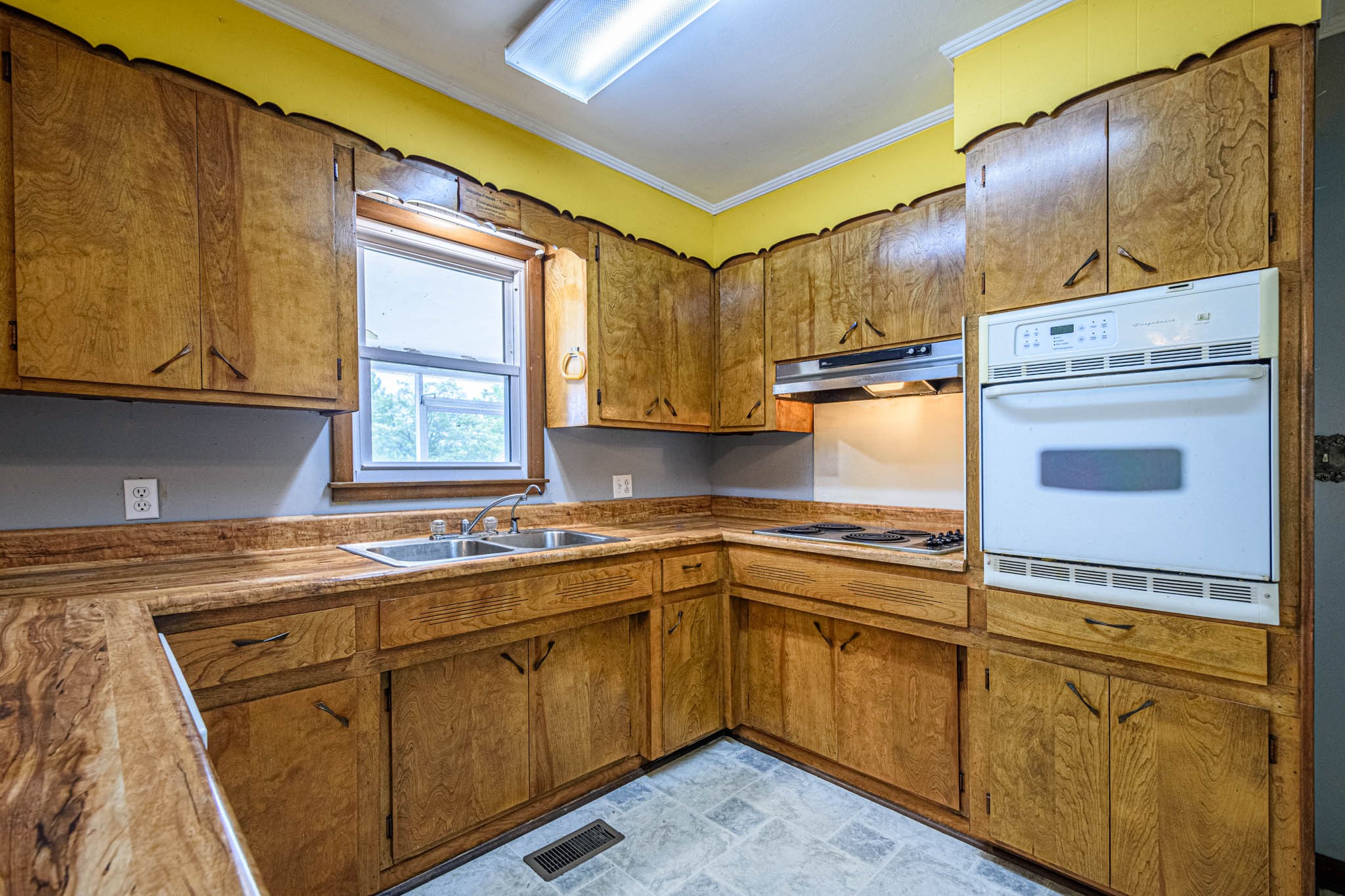 657 Prospect Road Pulaski, TN 38478 - Photo 25 of 50 a kitchen with a sink stove and cabinets