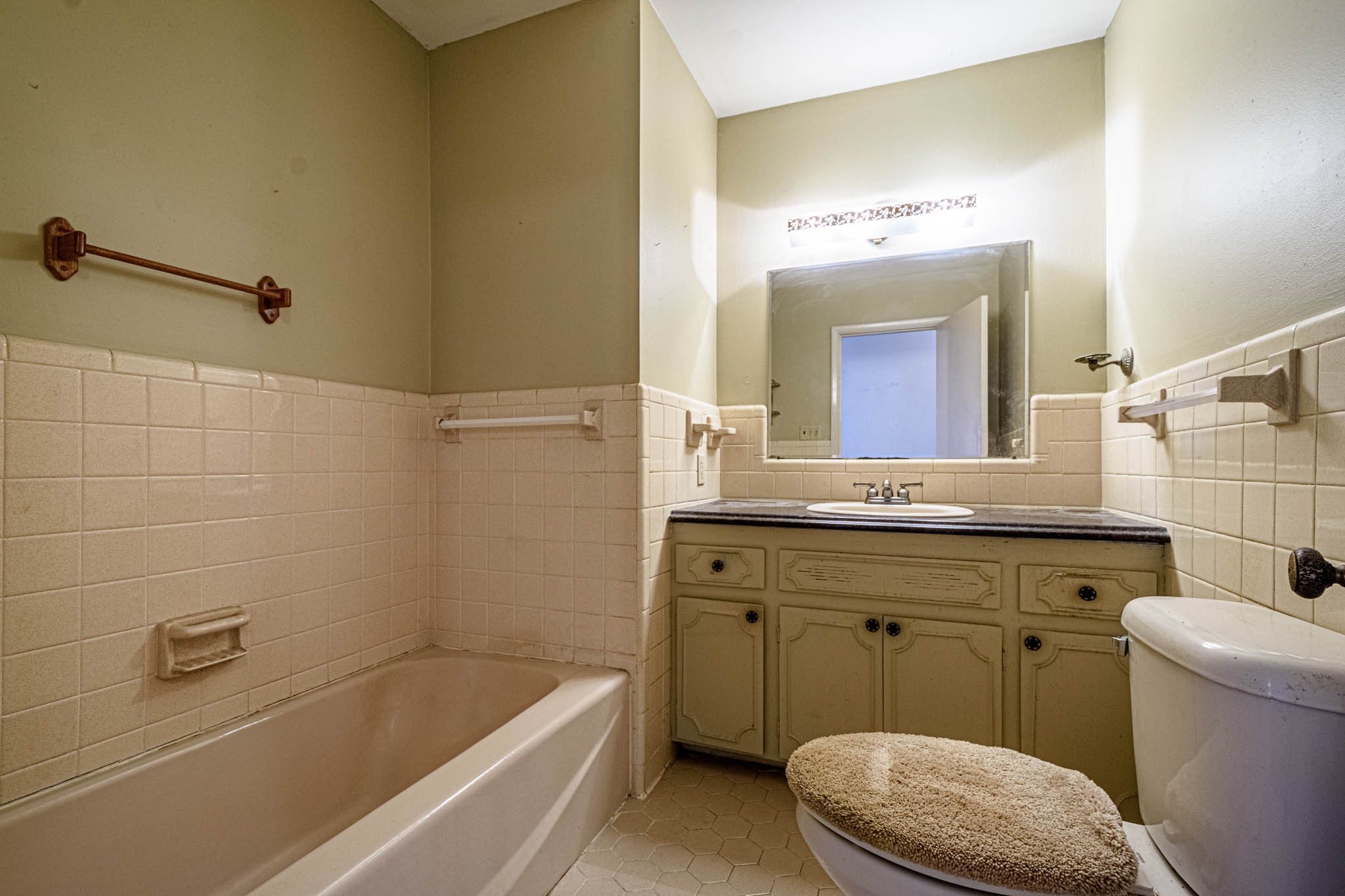 657 Prospect Road Pulaski, TN 38478 - Photo 30 of 50 a bathroom with a sink a toilet a mirror and bathtub