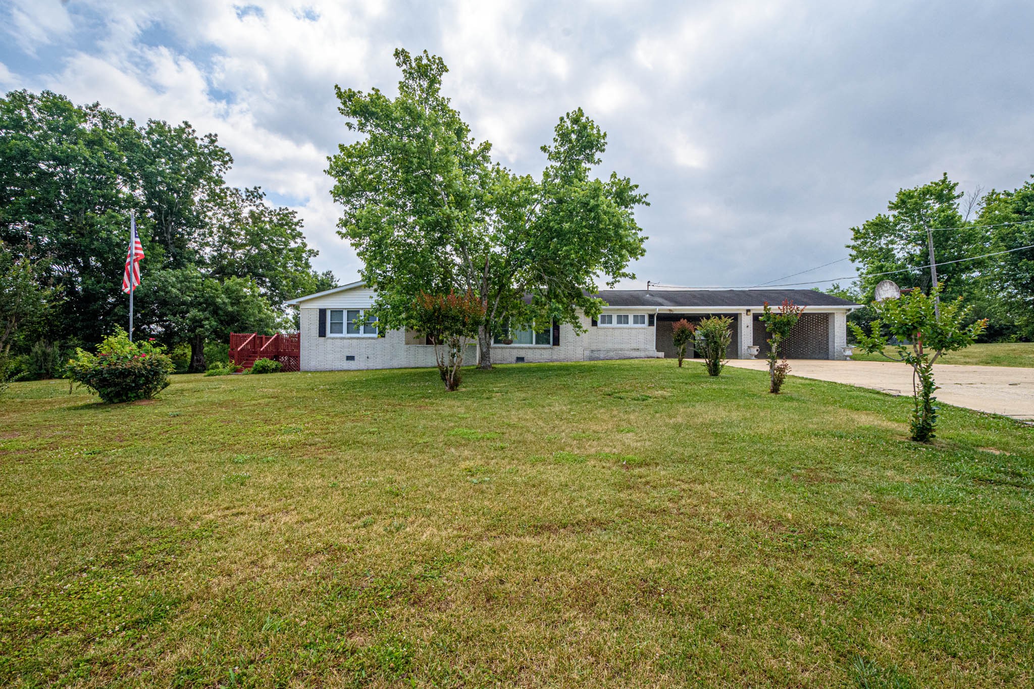 657 Prospect Road Pulaski, TN 38478 - Photo 3 of 50 a front view of a house with a yard and trees