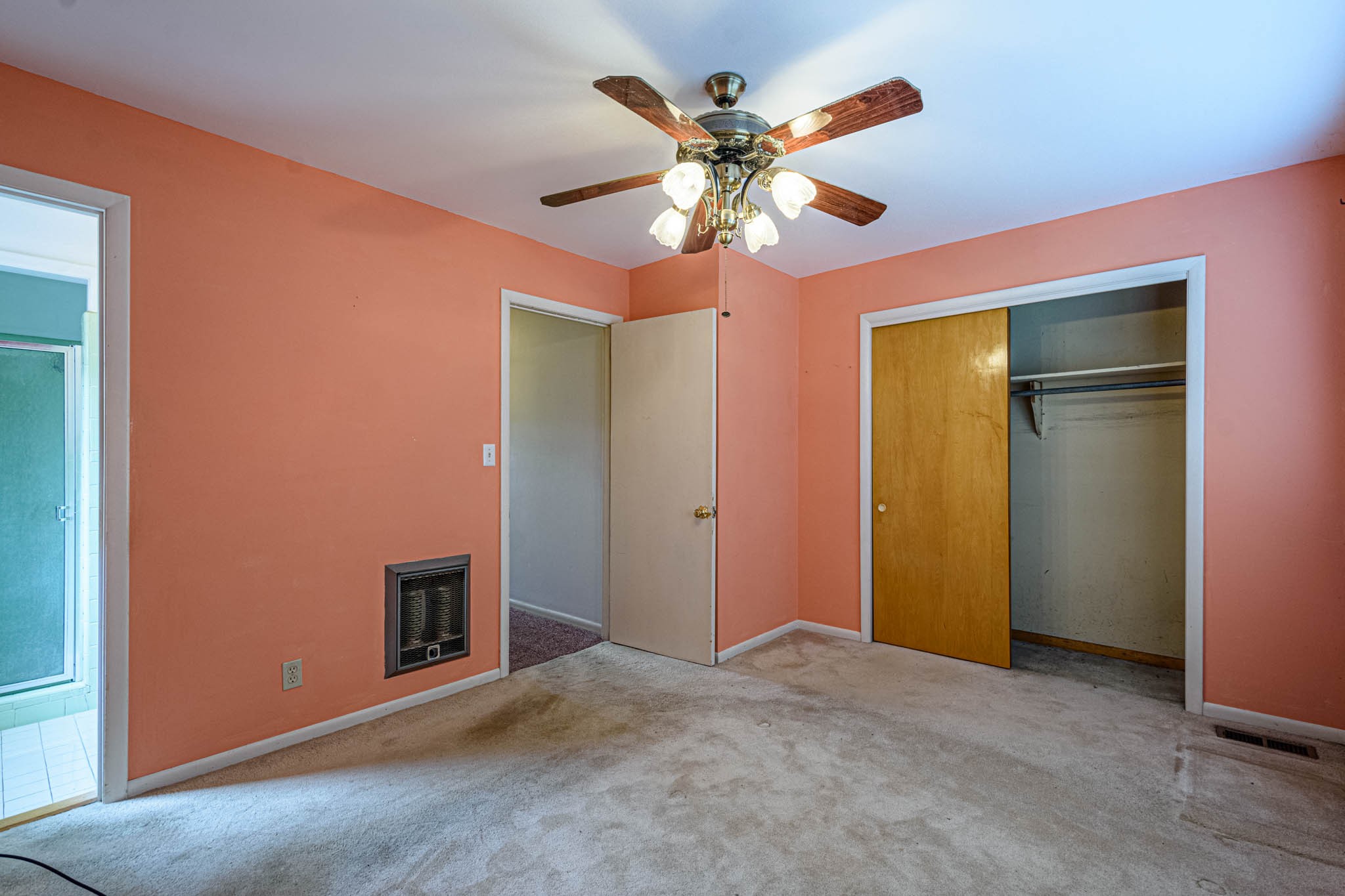 657 Prospect Road Pulaski, TN 38478 - Photo 34 of 50 an empty room with a chandelier fan and a large window
