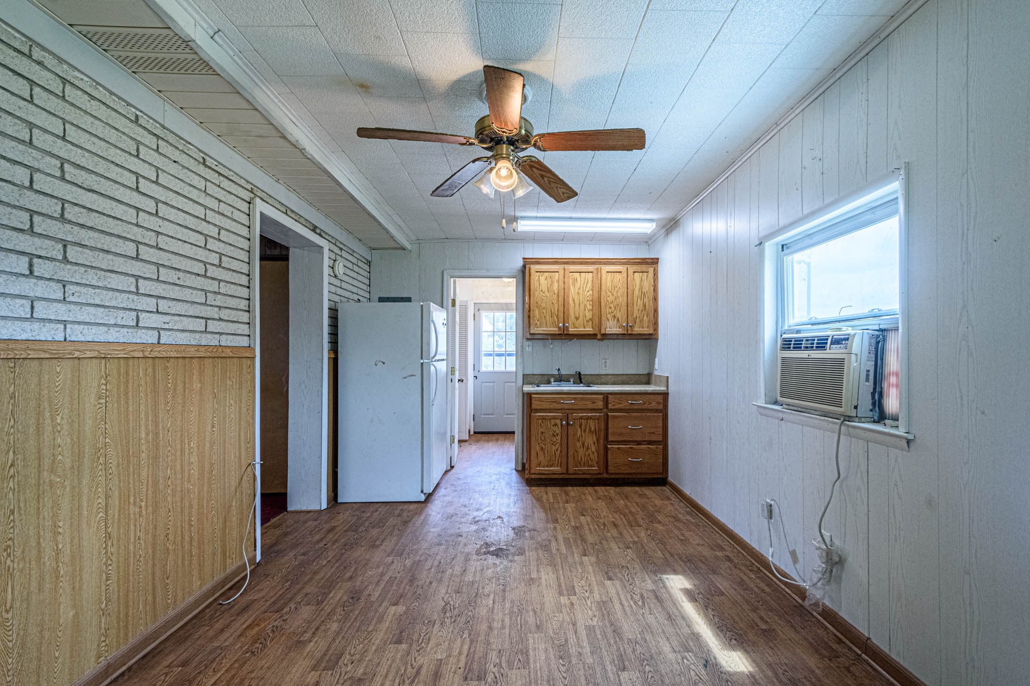 657 Prospect Road Pulaski, TN 38478 - Photo 39 of 50 a view of a livingroom with wooden floor and a ceiling fan