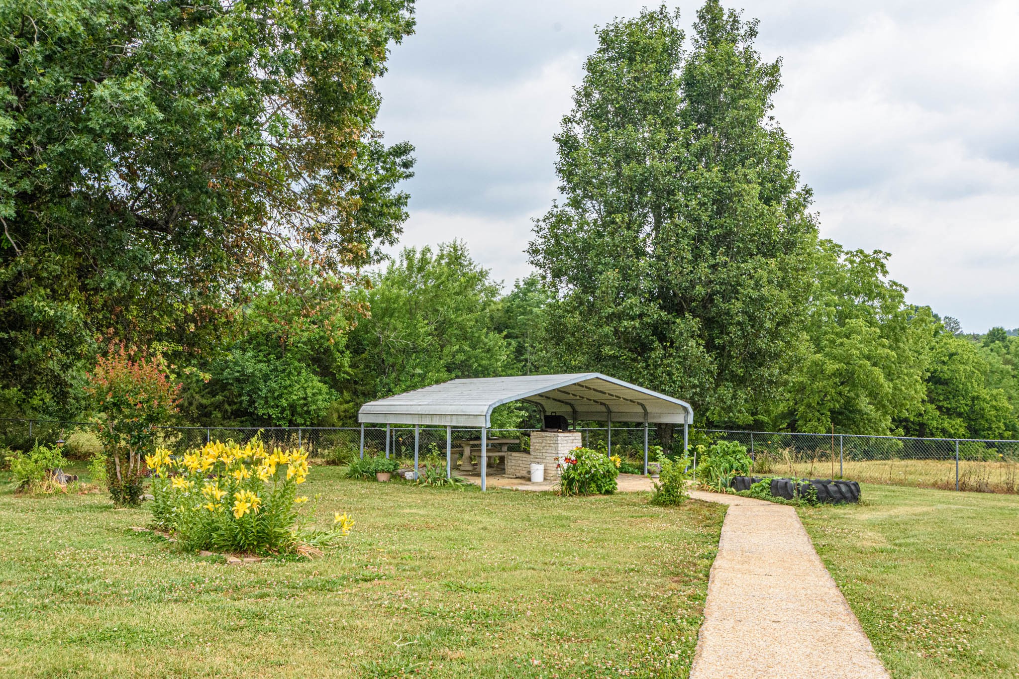 657 Prospect Road Pulaski, TN 38478 - Photo 46 of 50 a backyard of a house with yard and outdoor seating