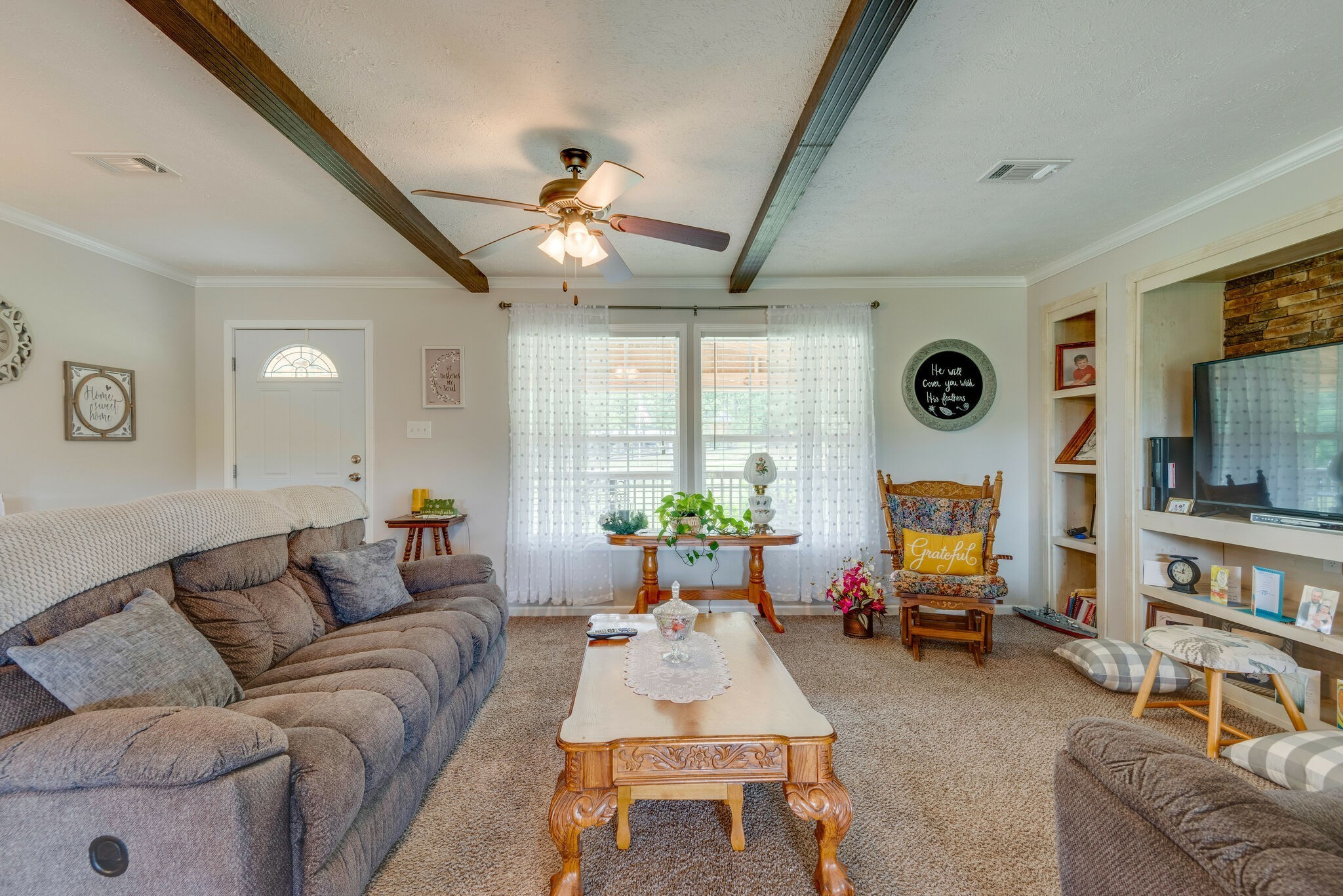 4585 West Tennessee City Road McEwen, TN 37101 - Photo 16 of 55 a living room with furniture a fireplace and a large window
