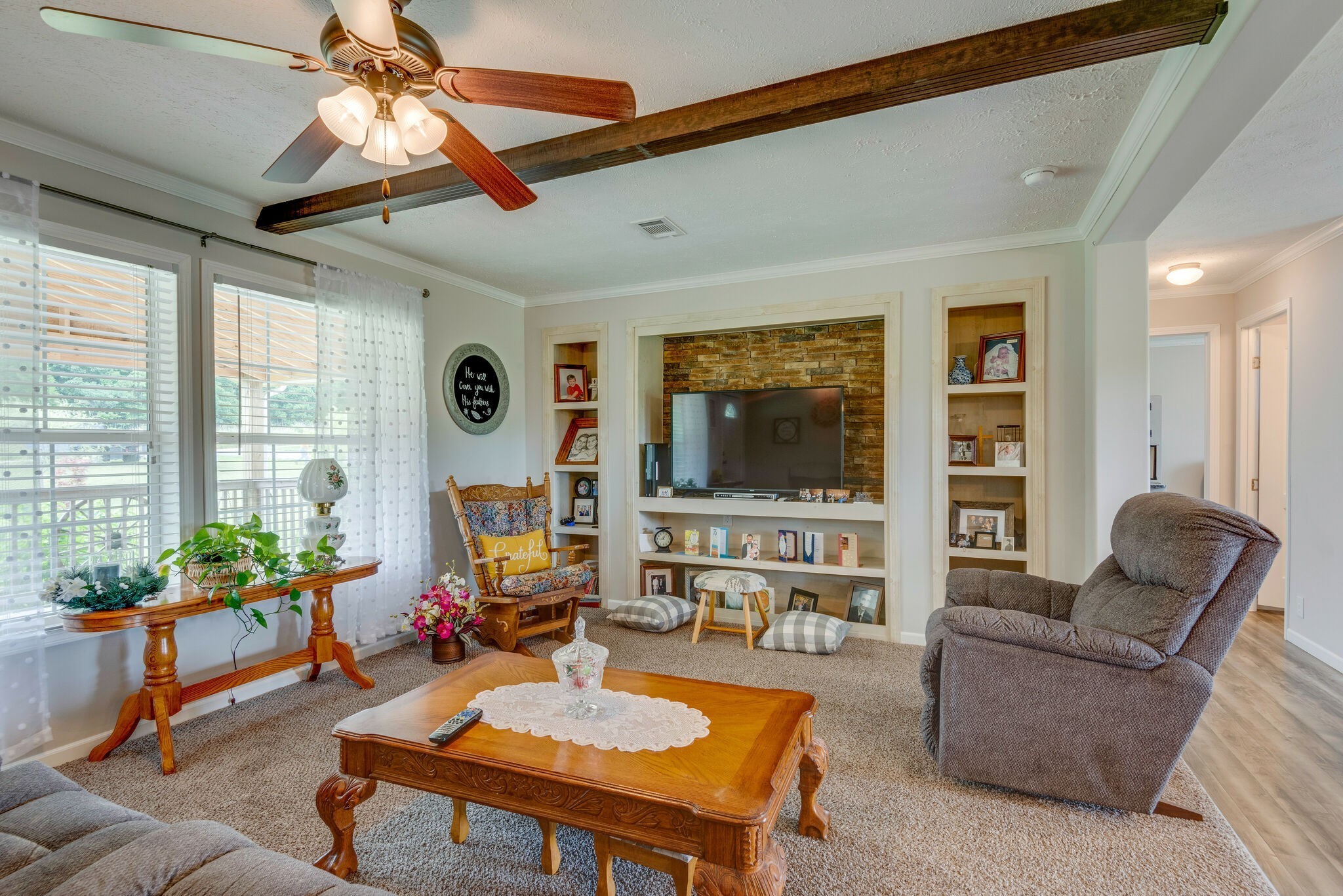 4585 West Tennessee City Road McEwen, TN 37101 - Photo 19 of 55 a living room with furniture a flat screen tv and a large window