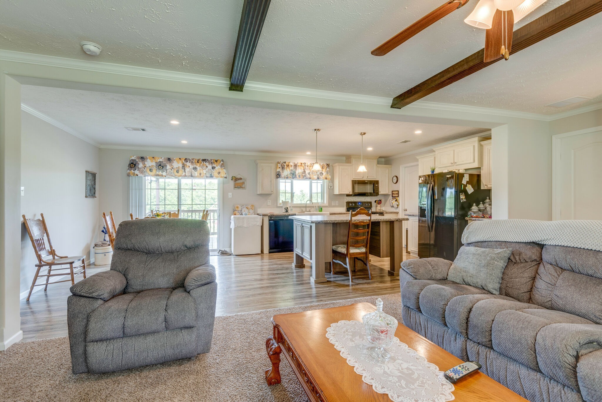 4585 West Tennessee City Road McEwen, TN 37101 - Photo 20 of 55 a living room with furniture wooden floor and a kitchen view