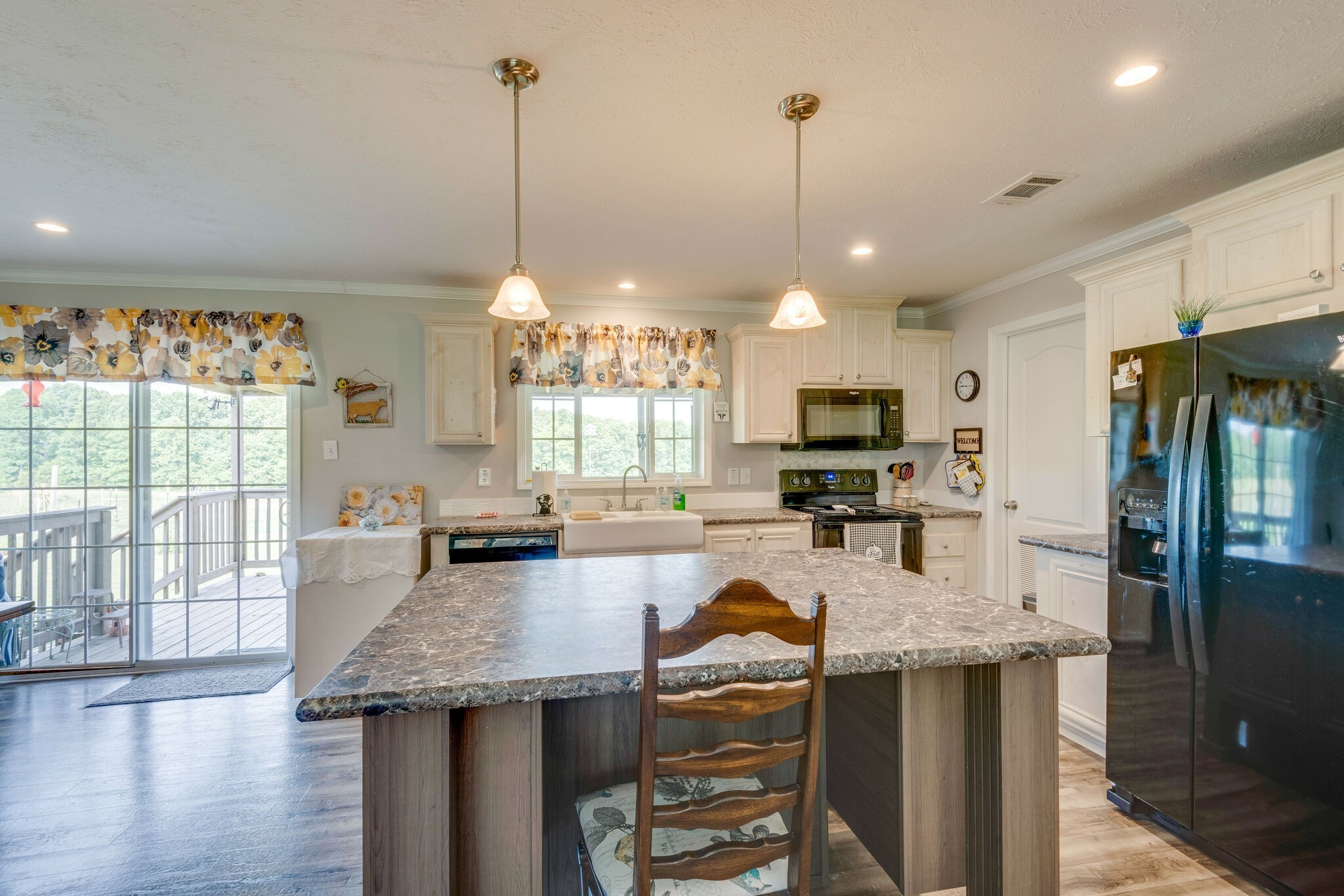 4585 West Tennessee City Road McEwen, TN 37101 - Photo 21 of 55 a kitchen with sink refrigerator and microwave