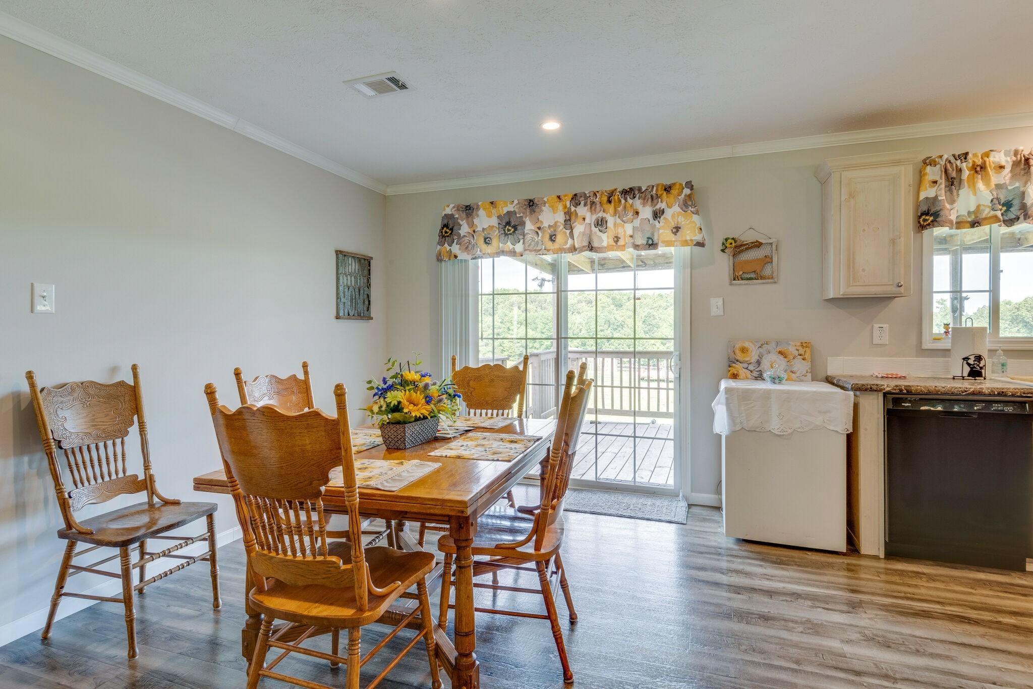 4585 West Tennessee City Road McEwen, TN 37101 - Photo 23 of 55 a view of a dining room with furniture and wooden floor