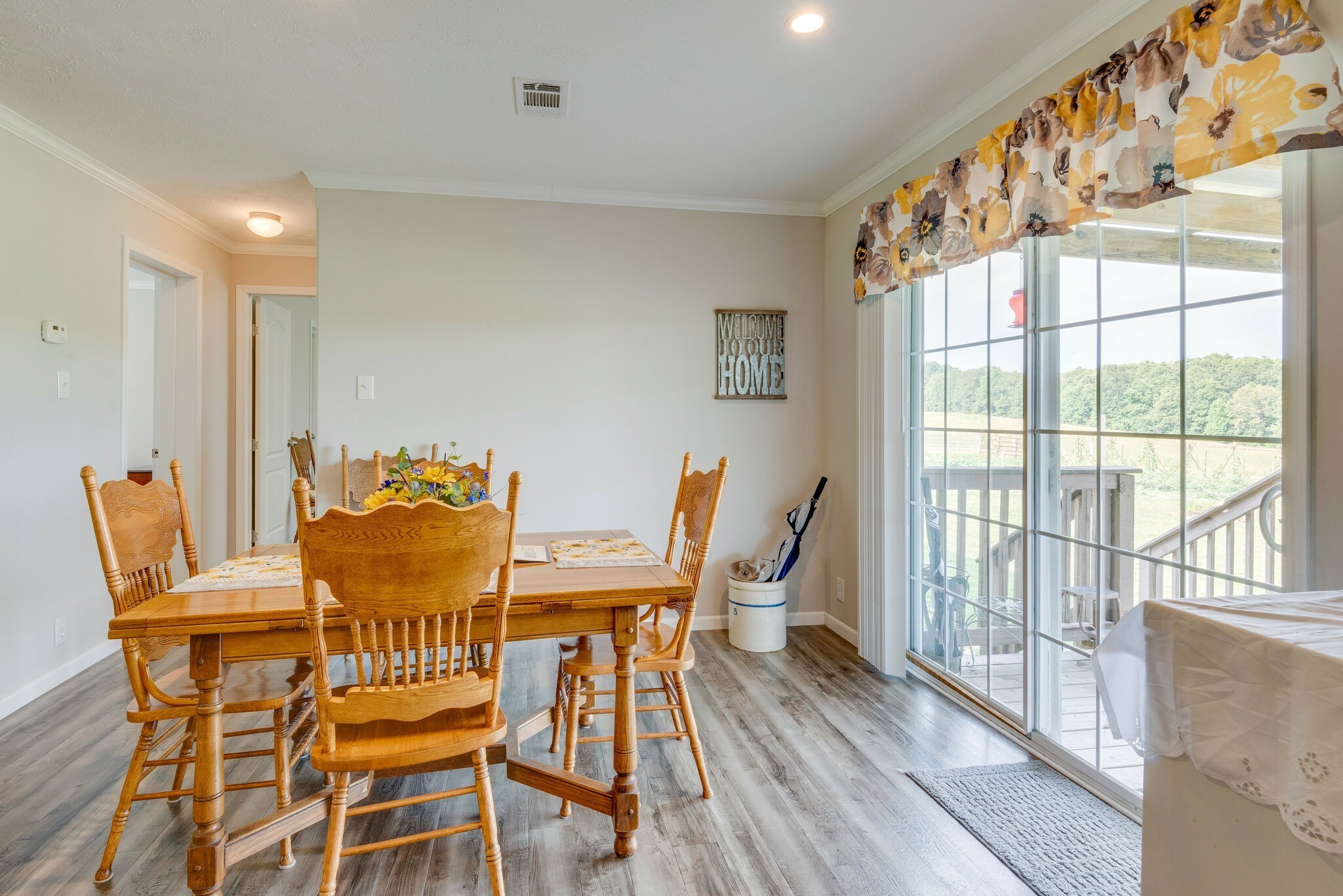 4585 West Tennessee City Road McEwen, TN 37101 - Photo 25 of 55 a dining room with furniture a chandelier and wooden floor