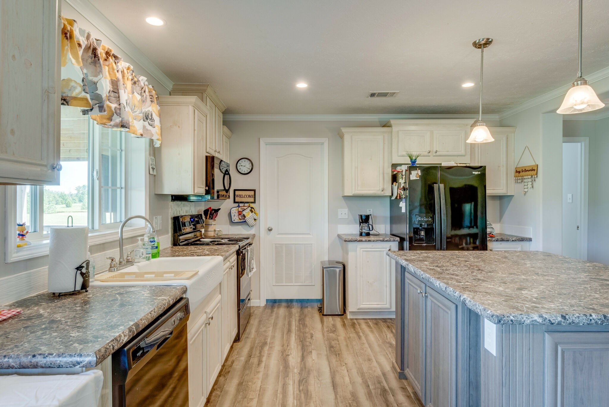 4585 West Tennessee City Road McEwen, TN 37101 - Photo 26 of 55 a kitchen with a sink stove and refrigerator